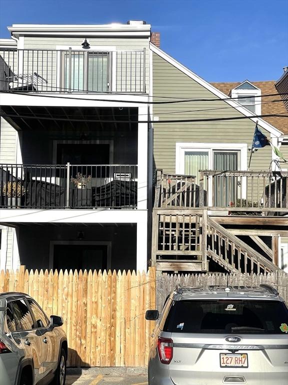 rear view of house with a balcony