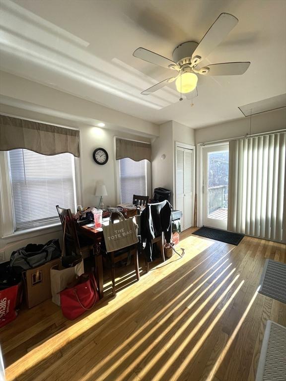 dining space featuring ceiling fan and hardwood / wood-style floors