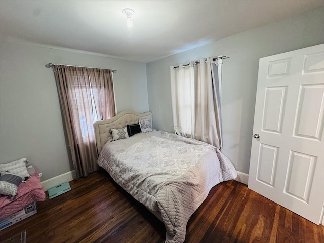 bedroom featuring dark hardwood / wood-style floors