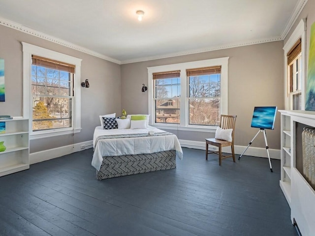 bedroom featuring dark hardwood / wood-style flooring and crown molding