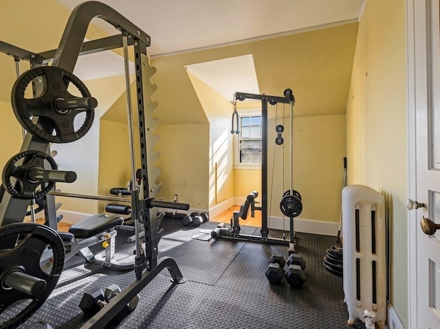 exercise area with ornamental molding and radiator