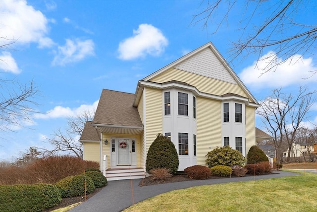 view of property featuring a front yard