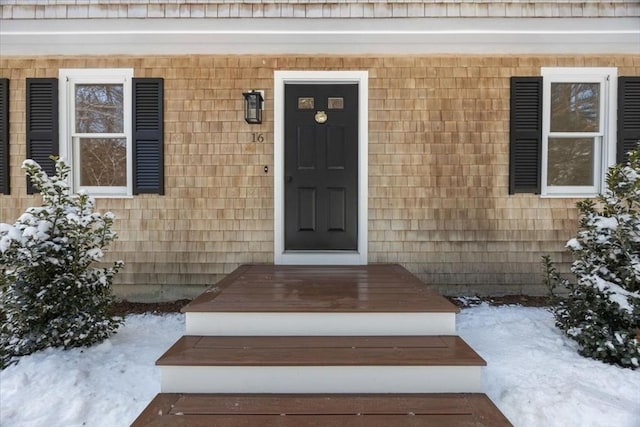 view of snow covered property entrance