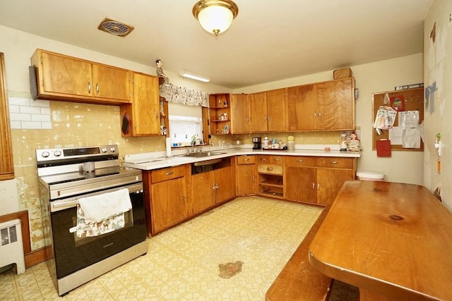 kitchen featuring visible vents, stainless steel electric stove, light floors, open shelves, and a sink