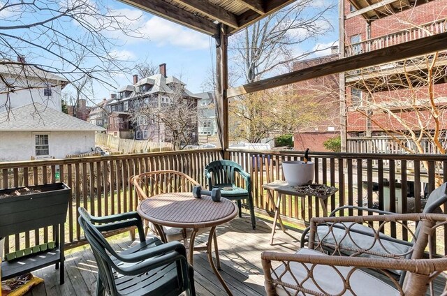 wooden terrace featuring a residential view