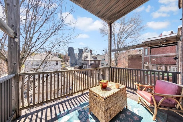 wooden terrace with a residential view