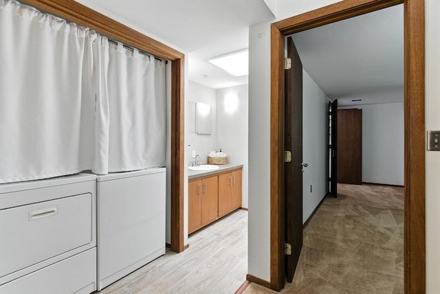 611 Old Stone Brk Unit 611, Acton, MA 01718 - bathroom with washing machine and dryer, vanity, and wood finished floors