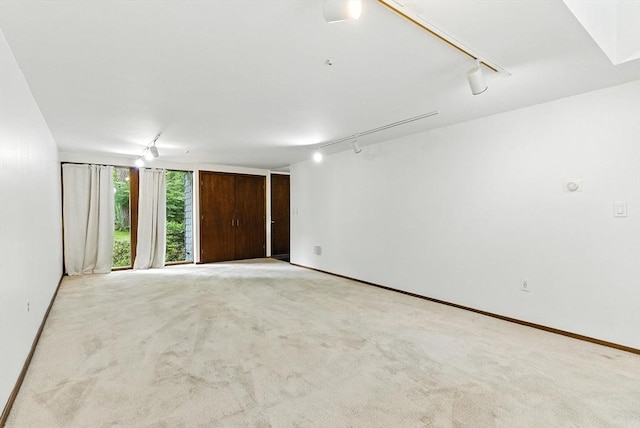 611 Old Stone Brk Unit 611, Acton, MA 01718 - empty room with track lighting and light carpet