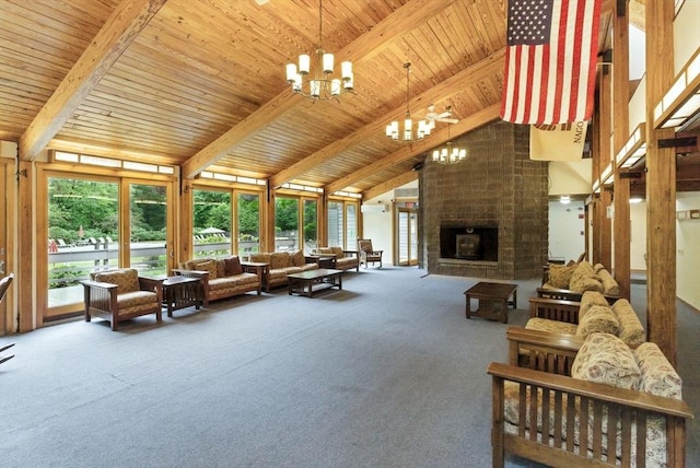 611 Old Stone Brk Unit 611, Acton, MA 01718 - carpeted living area with a chandelier, high vaulted ceiling, a wooden ceiling with exposed beams, and a large fireplace