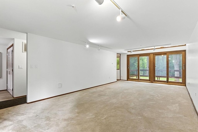 611 Old Stone Brk Unit 611, Acton, MA 01718 - carpeted empty room featuring rail lighting and baseboards