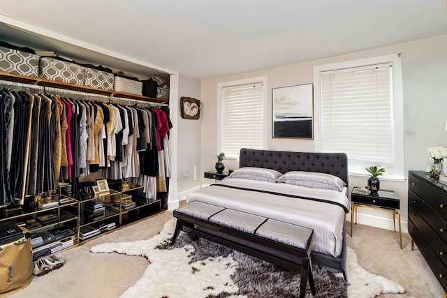 carpeted bedroom with a closet