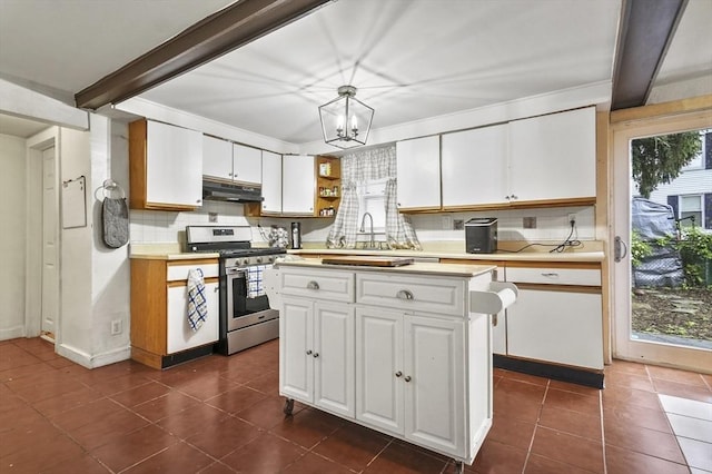 18 Cedar Ct, Lowell, MA 01852 - kitchen featuring gas stove, under cabinet range hood, backsplash, healthy amount of natural light, and beamed ceiling