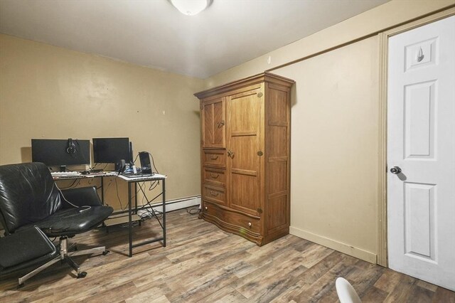 18 Cedar Ct, Lowell, MA 01852 - office with wood finished floors, baseboards, and baseboard heating