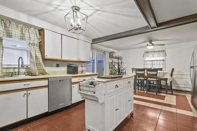 18 Cedar Ct, Lowell, MA 01852 - kitchen featuring stainless steel appliances, a sink, light countertops, dark tile patterned flooring, and white cabinetry