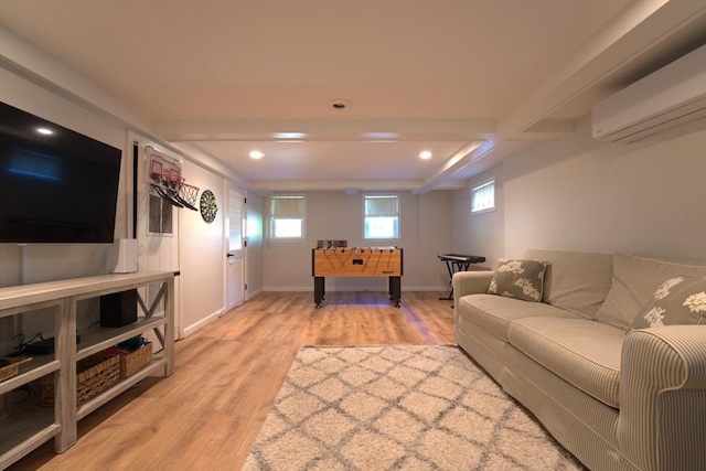 living room featuring recessed lighting, a wall unit AC, light wood-style flooring, and plenty of natural light