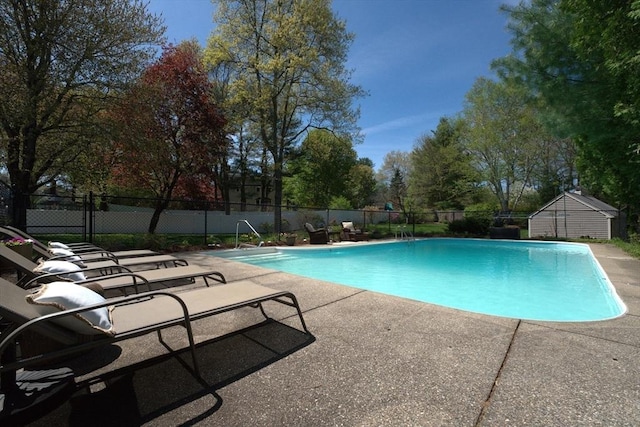 view of pool with fence, a fenced in pool, and a patio