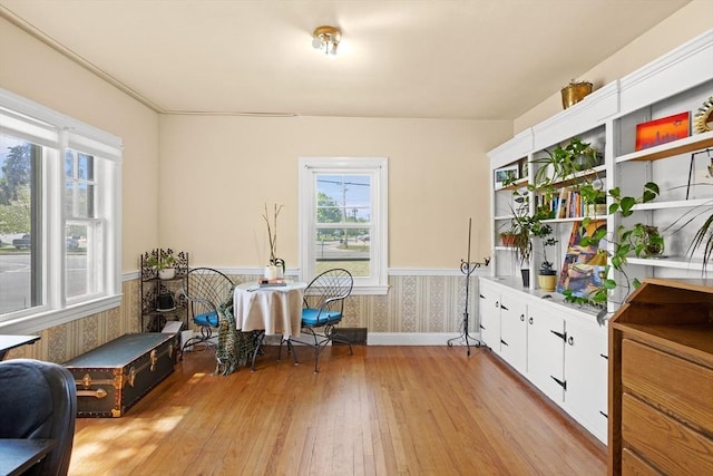 206 Pleasant St, North Andover, MA 01845 - home office featuring light wood-style floors, wallpapered walls, baseboards, and wainscoting