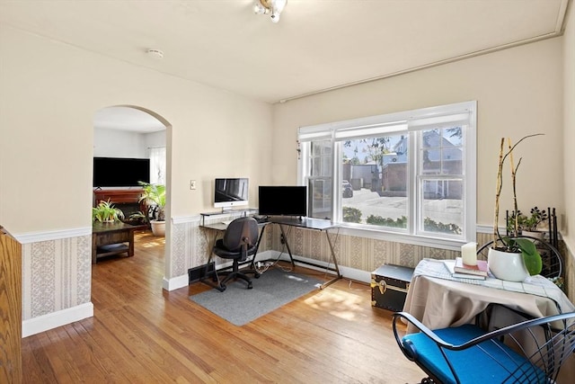 206 Pleasant St, North Andover, MA 01845 - office area with wood finished floors, arched walkways, wallpapered walls, a wainscoted wall, and baseboards