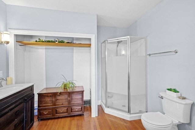 206 Pleasant St, North Andover, MA 01845 - full bath featuring a stall shower, wood finished floors, toilet, and vanity