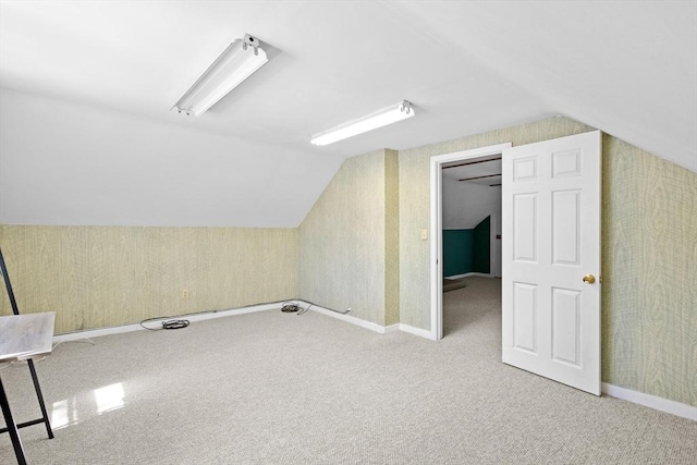 206 Pleasant St, North Andover, MA 01845 - additional living space featuring vaulted ceiling, carpet flooring, wallpapered walls, and baseboards