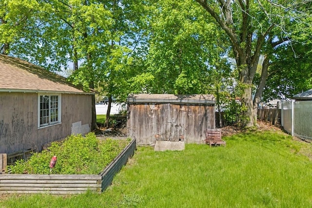 206 Pleasant St, North Andover, MA 01845 - view of yard with a storage shed and an outbuilding