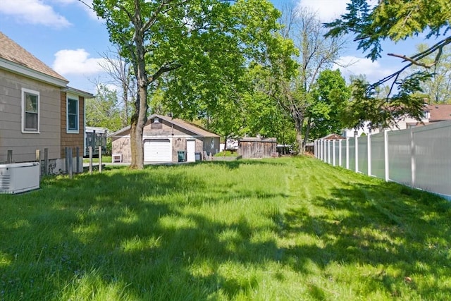 206 Pleasant St, North Andover, MA 01845 - view of yard featuring an outdoor structure and a detached garage