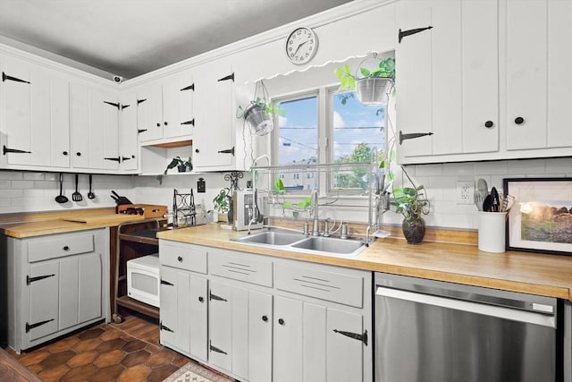 206 Pleasant St, North Andover, MA 01845 - kitchen with dishwasher, butcher block countertops, tasteful backsplash, and white cabinetry