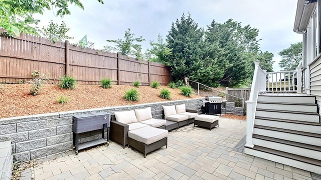 view of patio with area for grilling and an outdoor hangout area