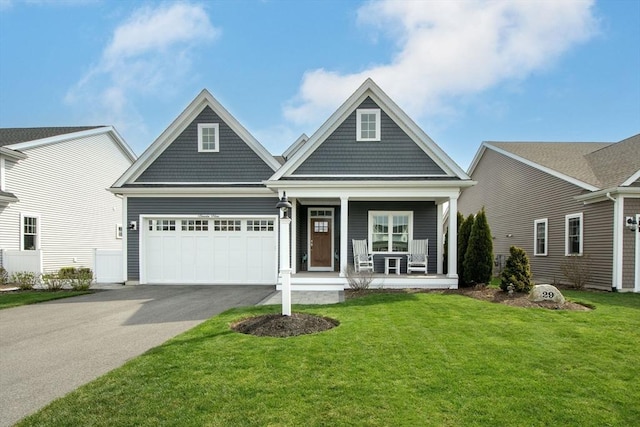 29 Spyglass Ln, Plymouth, MA 02360 - view of front of house featuring a porch, driveway, a front lawn, and a garage