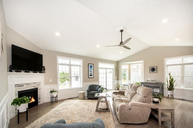 29 Spyglass Ln, Plymouth, MA 02360 - living room featuring a fireplace, lofted ceiling, a wainscoted wall, wood finished floors, and ceiling fan