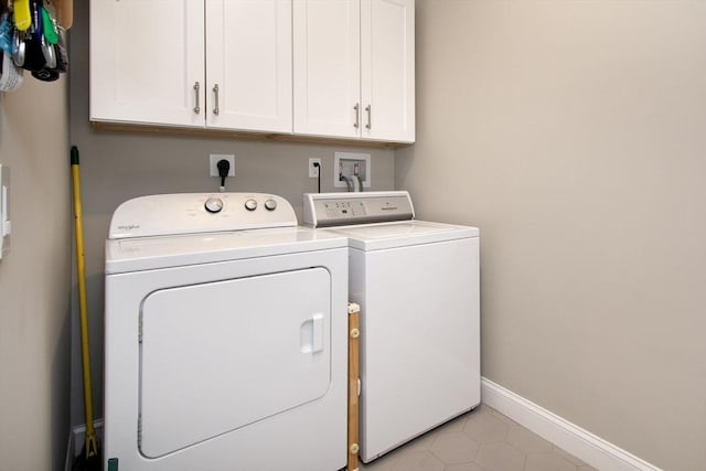 29 Spyglass Ln, Plymouth, MA 02360 - laundry room featuring separate washer and dryer, cabinet space, baseboards, and light tile patterned floors