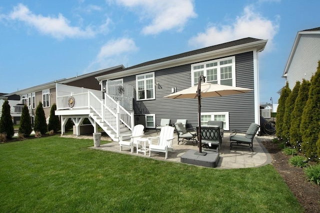 29 Spyglass Ln, Plymouth, MA 02360 - rear view of house featuring stairs, a lawn, a patio, and a deck