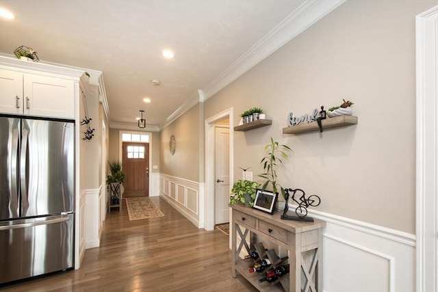 29 Spyglass Ln, Plymouth, MA 02360 - entryway featuring crown molding, a decorative wall, a wainscoted wall, wood finished floors, and recessed lighting