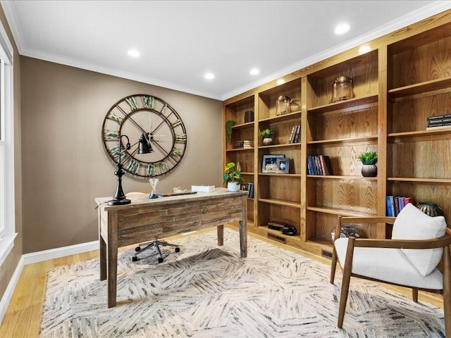 office space with crown molding and light hardwood / wood-style flooring