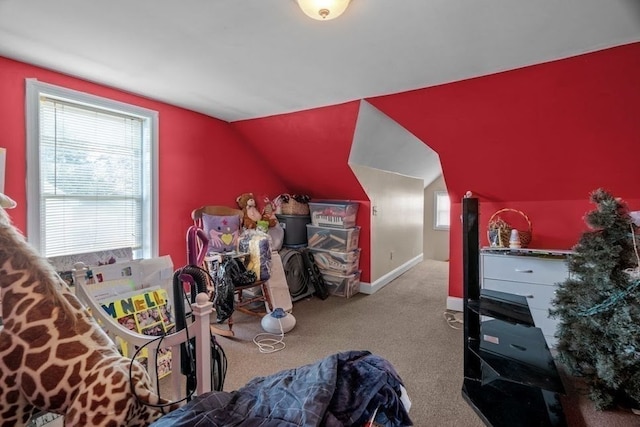 bonus room with lofted ceiling and light colored carpet