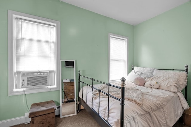 bedroom featuring cooling unit and carpet flooring