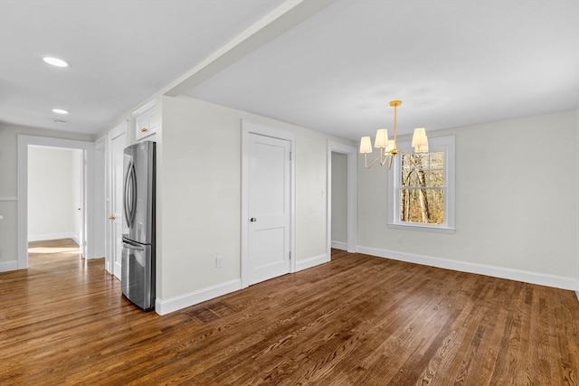 interior space featuring a chandelier and wood-type flooring