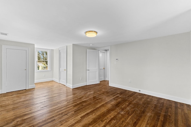 spare room with hardwood / wood-style flooring