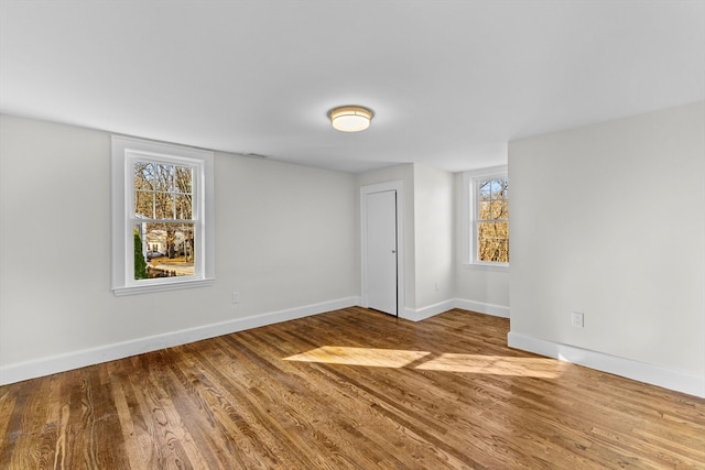 empty room featuring hardwood / wood-style flooring