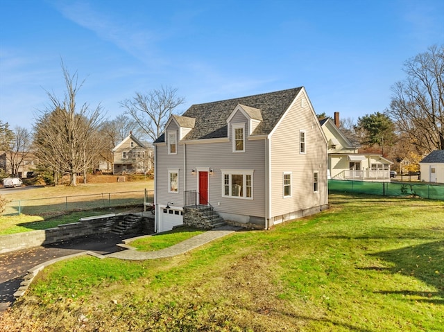 back of house with a yard