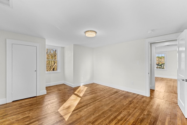 unfurnished room featuring wood-type flooring