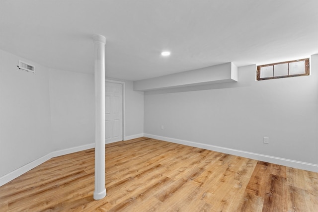 basement featuring light hardwood / wood-style flooring