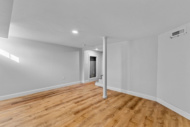 basement featuring light wood-type flooring