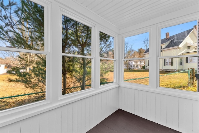 unfurnished sunroom featuring radiator