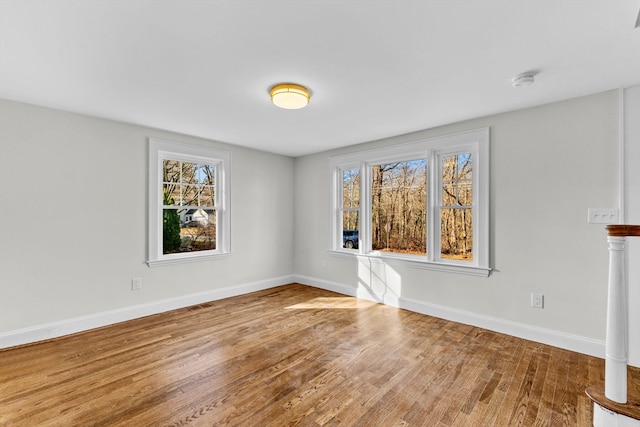 empty room featuring hardwood / wood-style floors