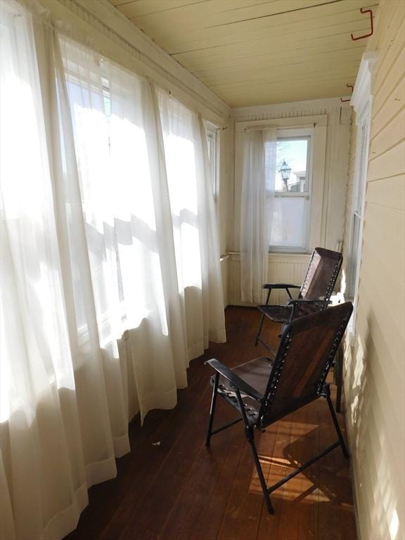 sunroom / solarium featuring wood ceiling