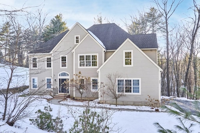 view of front of property featuring a shingled roof