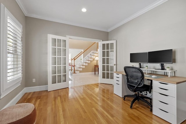 office with light wood finished floors, baseboards, ornamental molding, and french doors