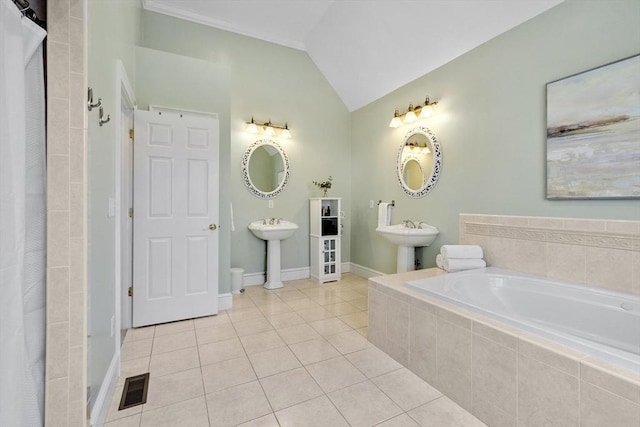 full bath with lofted ceiling, visible vents, baseboards, tile patterned floors, and tiled tub