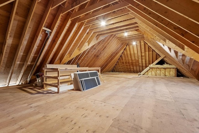 attic featuring an upstairs landing